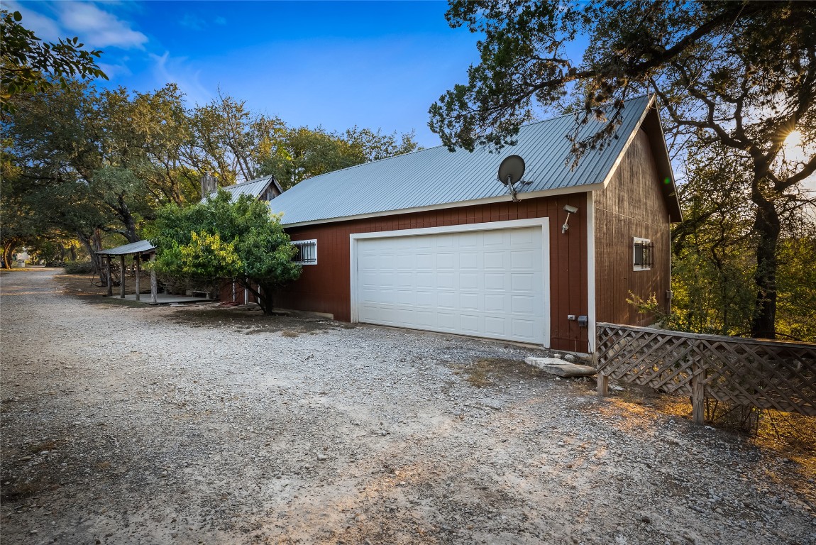 16020 Pool Canyon Road Austin, TX 78734 - Photo 9 of 29 a view of a house with a yard and garage