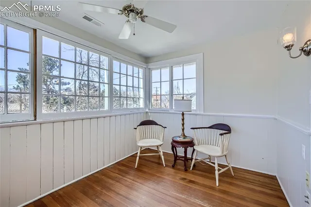 a view of a room with furniture window and wooden floor