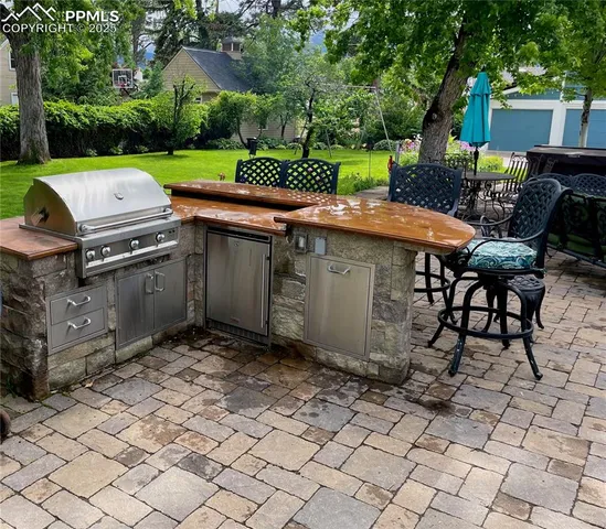 a view of backyard with outdoor seating