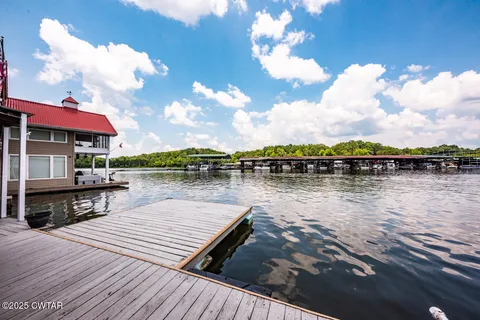 a lake view with a table and chairs