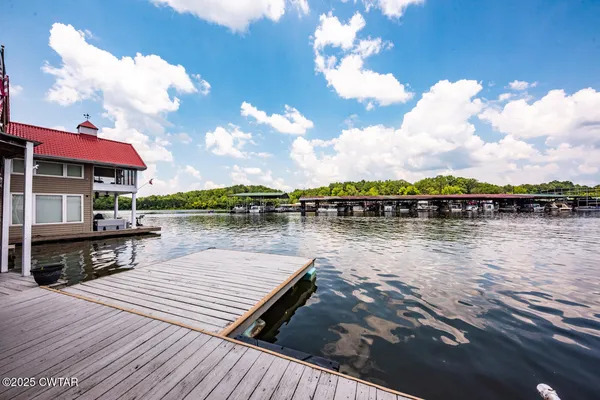 a lake view with a table and chairs