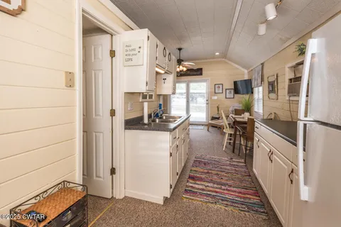 a bathroom with a toilet a sink and a mirror