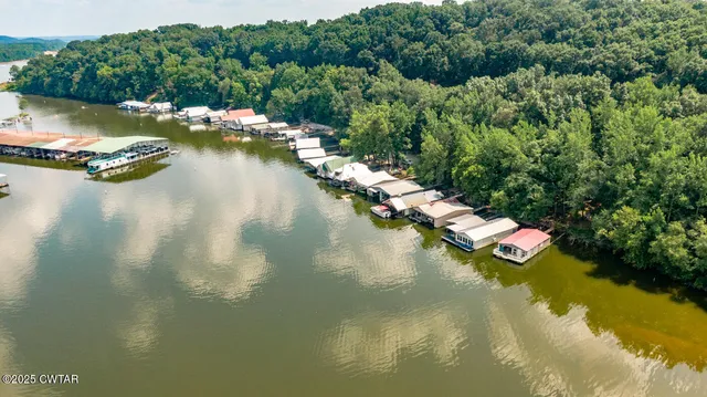 a view of swimming pool with seating space