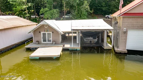 a view of swimming pool with sitting area
