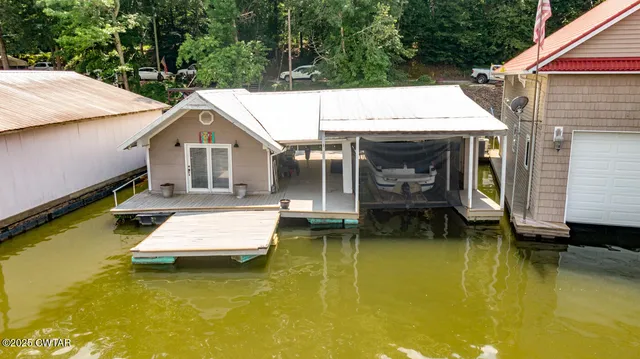 a view of swimming pool with sitting area