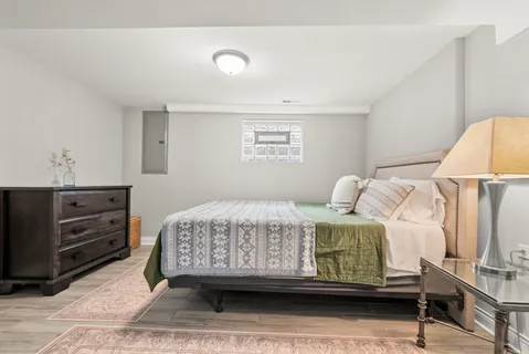 a bedroom with a bed and a dresser