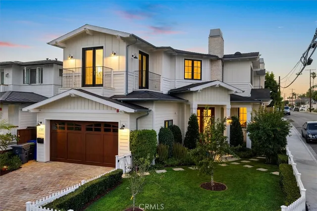 a dining room with furniture a chandelier and wooden floor