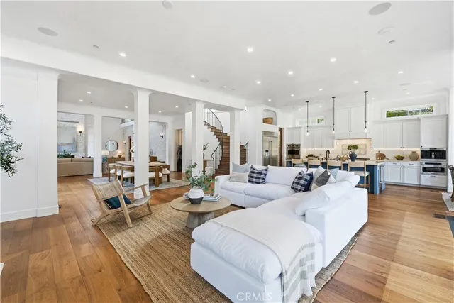 a spacious bedroom with a large bed a rug and a window