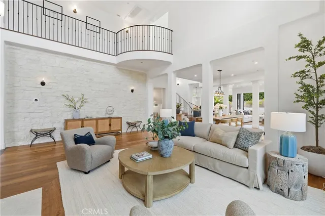 a bedroom with bed and a large window