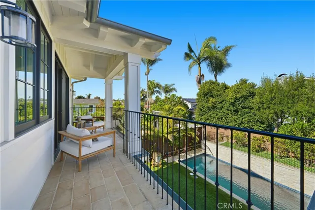 a bathroom with a double vanity sink a mirror and a bathtub