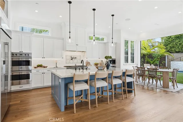 a patio of a house with table and chairs