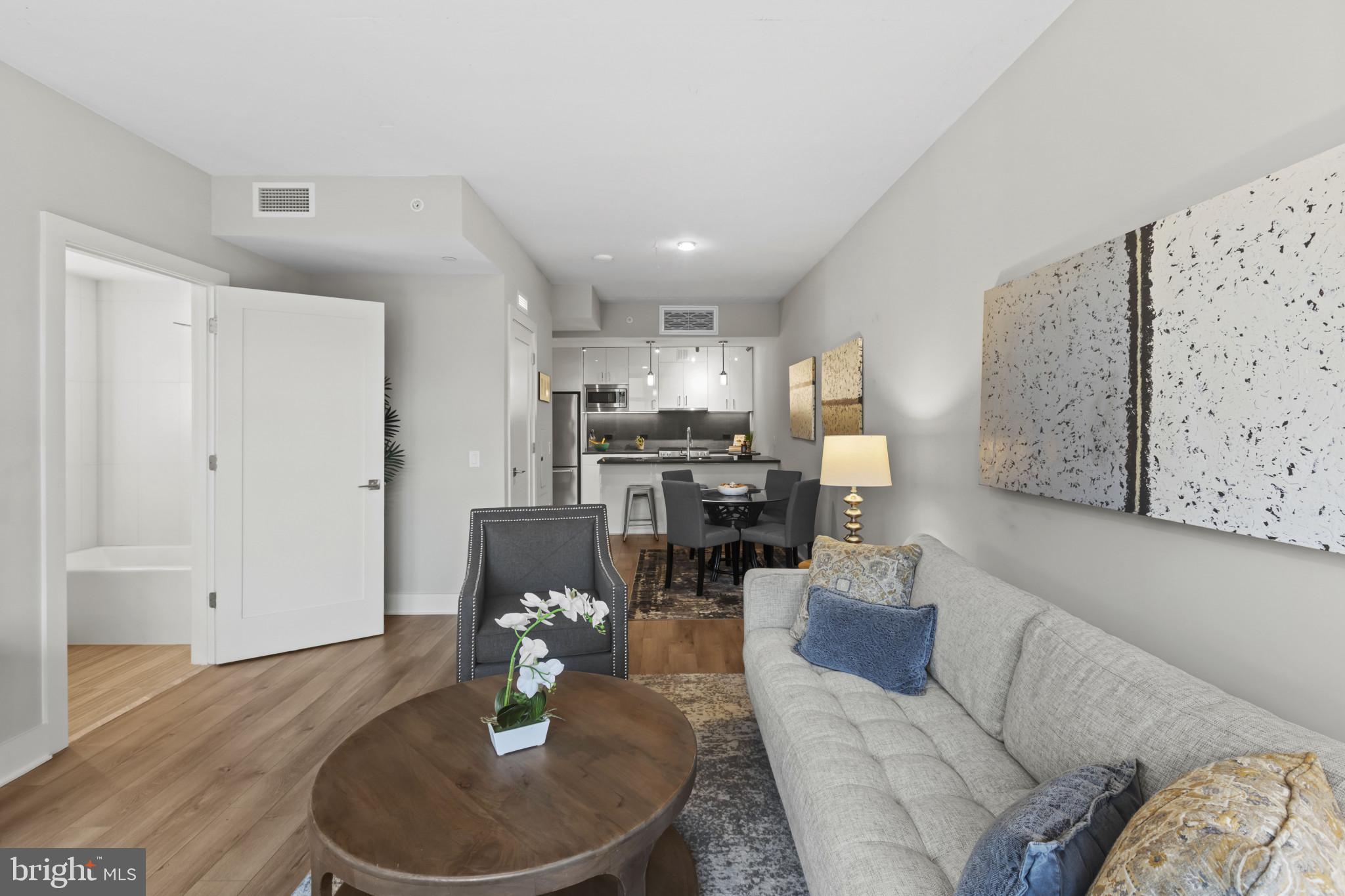 88 V Street Southwest, Unit 710 Washington, DC 20024 - Photo 18 of 44 a living room with furniture and kitchen view
