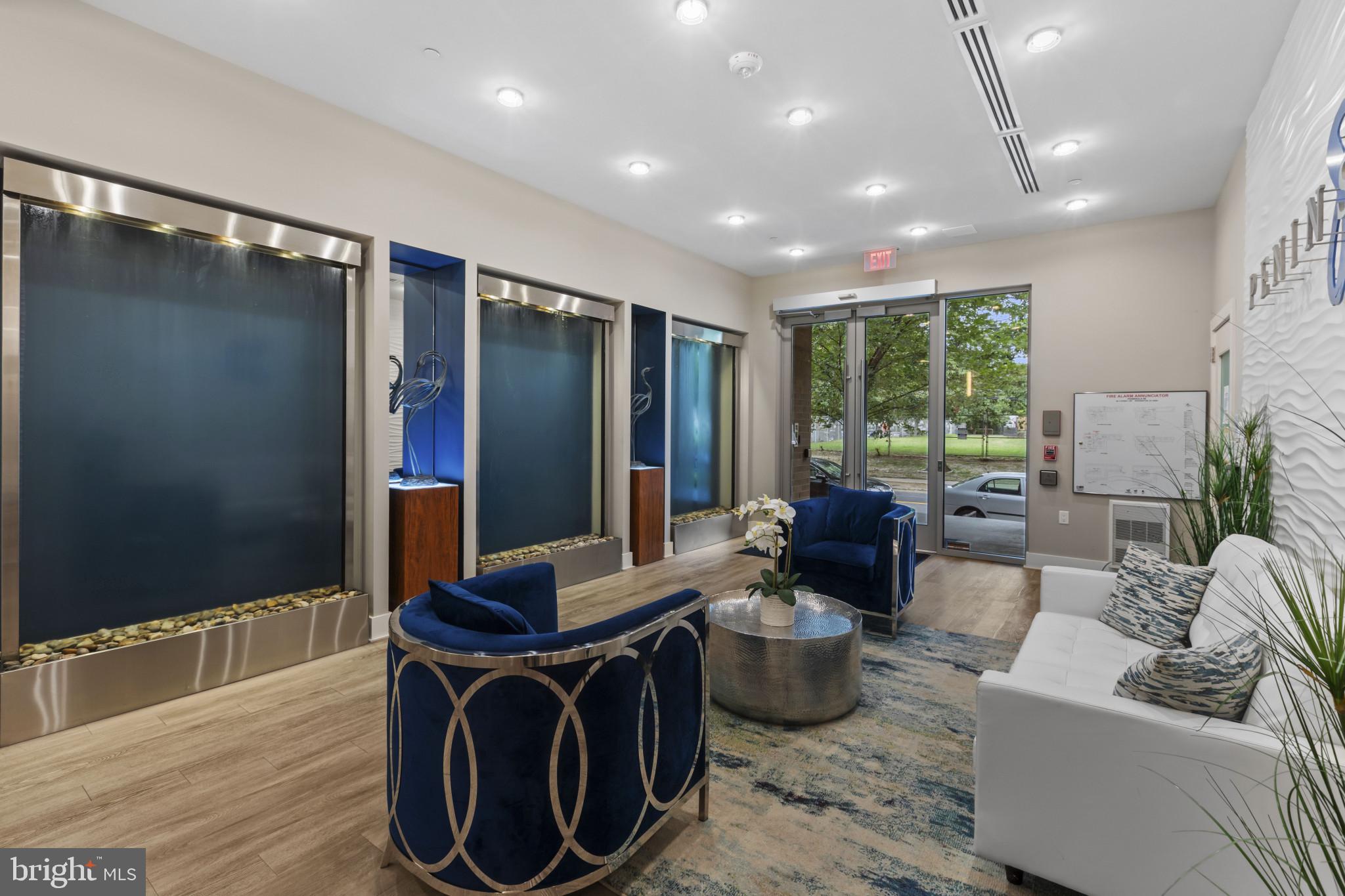 88 V Street Southwest, Unit 710 Washington, DC 20024 - Photo 35 of 44 a living room with furniture a large window and a wooden floor