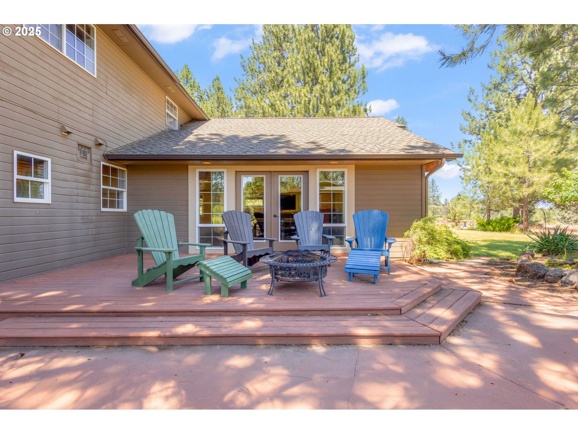 19723 Buck Canyon Road Bend, OR 97702 - Photo 31 of 48 a view of a house with backyard porch and sitting area