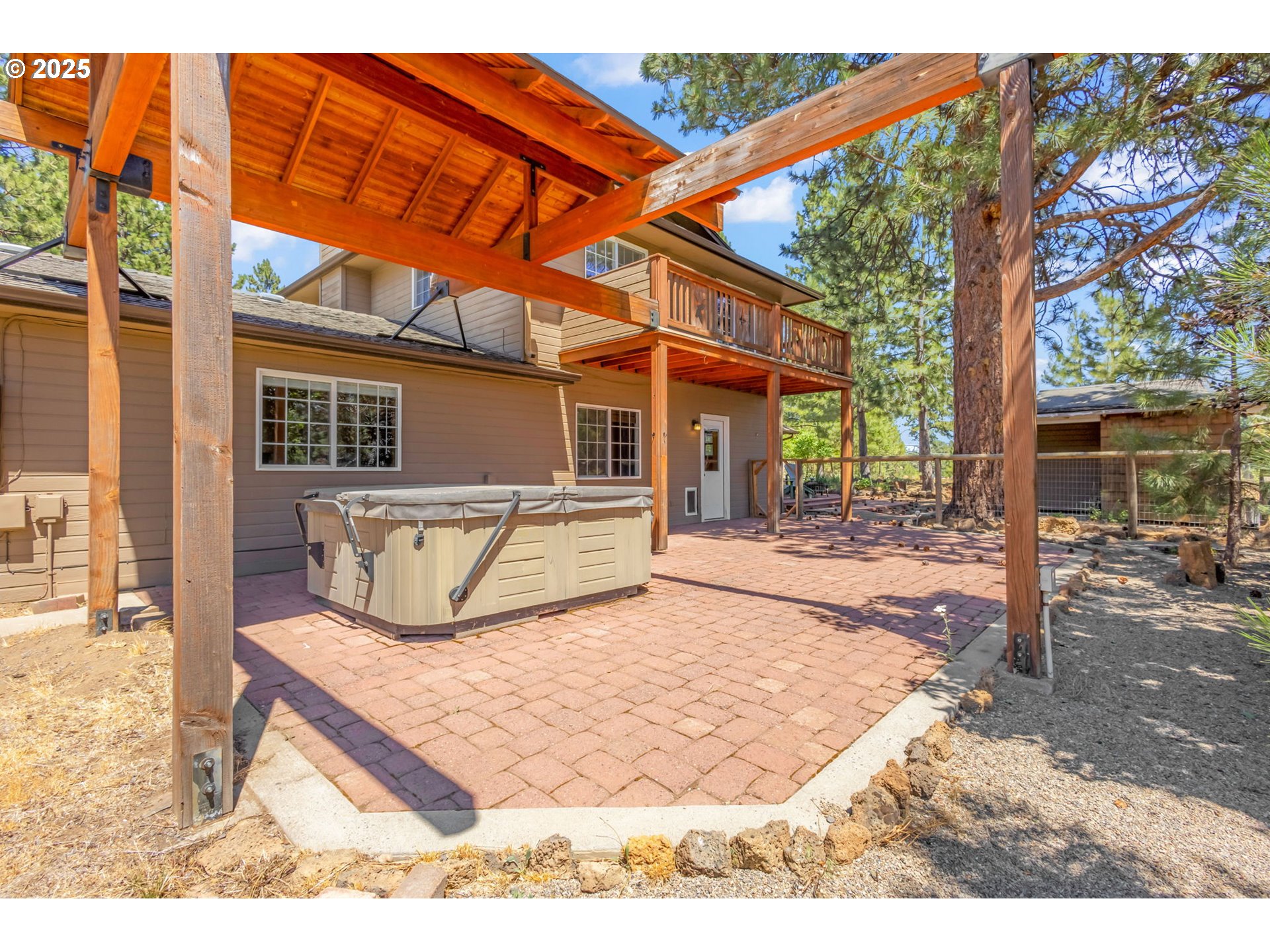 19723 Buck Canyon Road Bend, OR 97702 - Photo 33 of 48 a view of a backyard with a patio