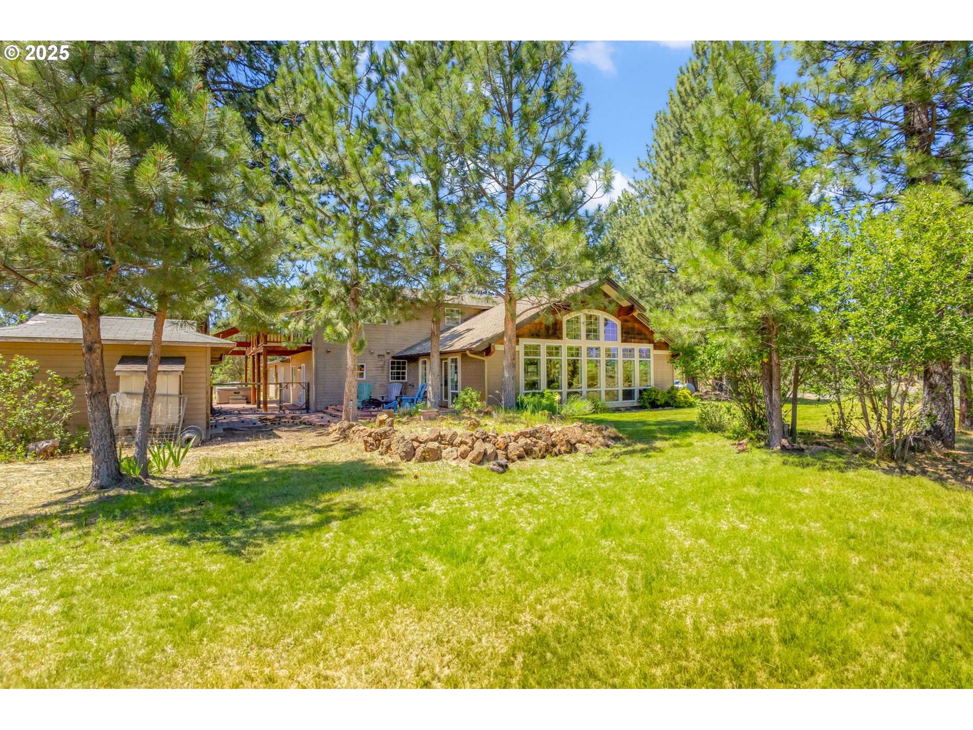 19723 Buck Canyon Road Bend, OR 97702 - Photo 34 of 48 a swimming pool with outdoor seating and yard