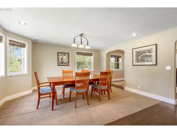 a dining room with furniture and window