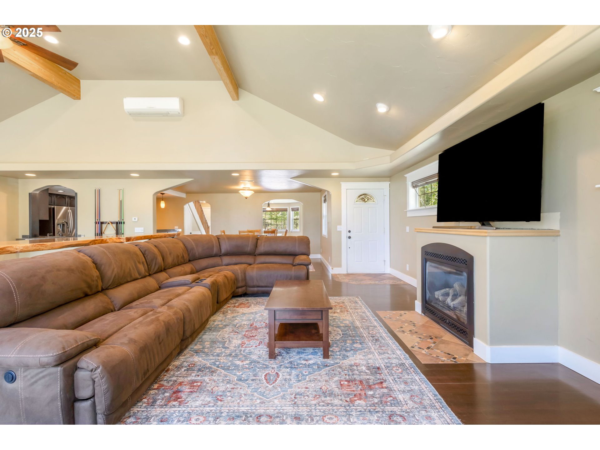 19723 Buck Canyon Road Bend, OR 97702 - Photo 9 of 48 a living room with furniture and a flat screen tv