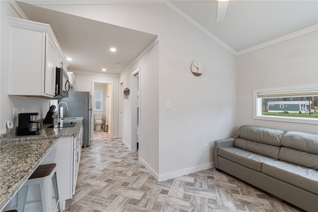 7150 Garner Road, Unit 40 Wolcott, NY 14590 - Photo 8 of 20 The view to the kitchen- bed and bath