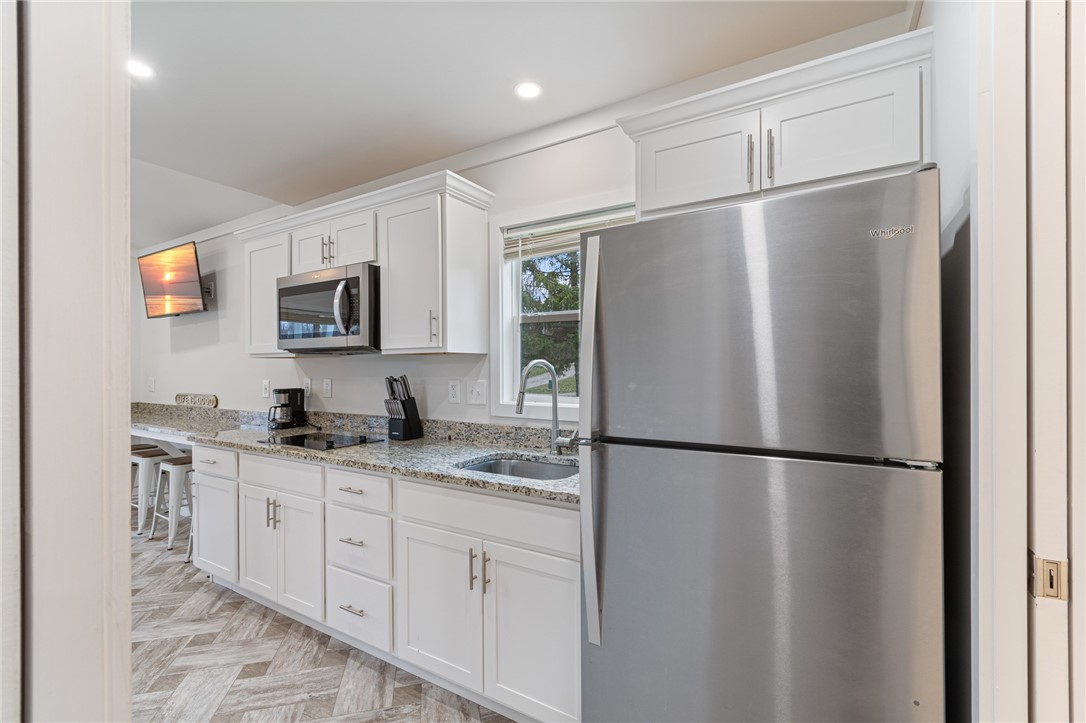 7150 Garner Road, Unit 40 Wolcott, NY 14590 - Photo 10 of 20 The kitchen has granite counters AND stainless app