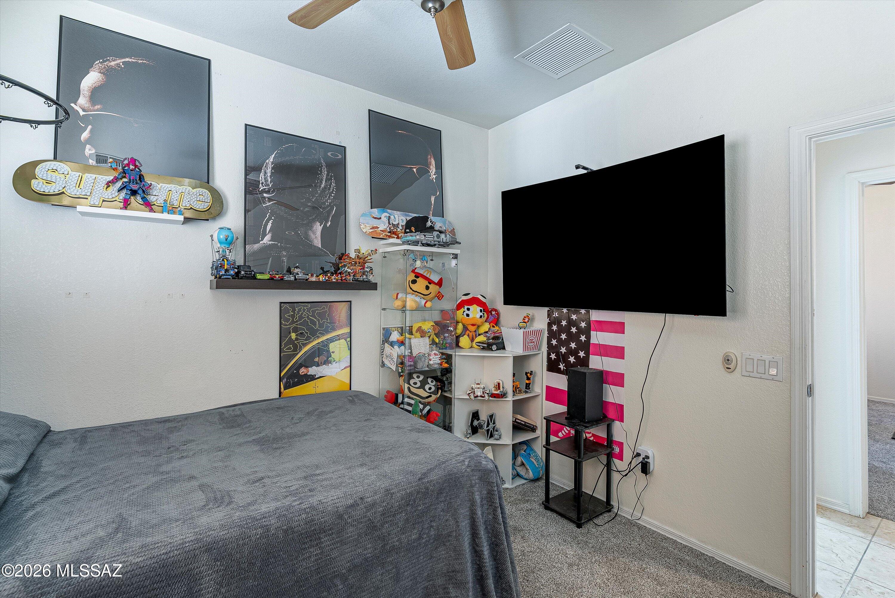 21163 East Treasure Road Red Rock, AZ 85145 - Photo 24 of 35 a children room with furniture and a flat screen tv