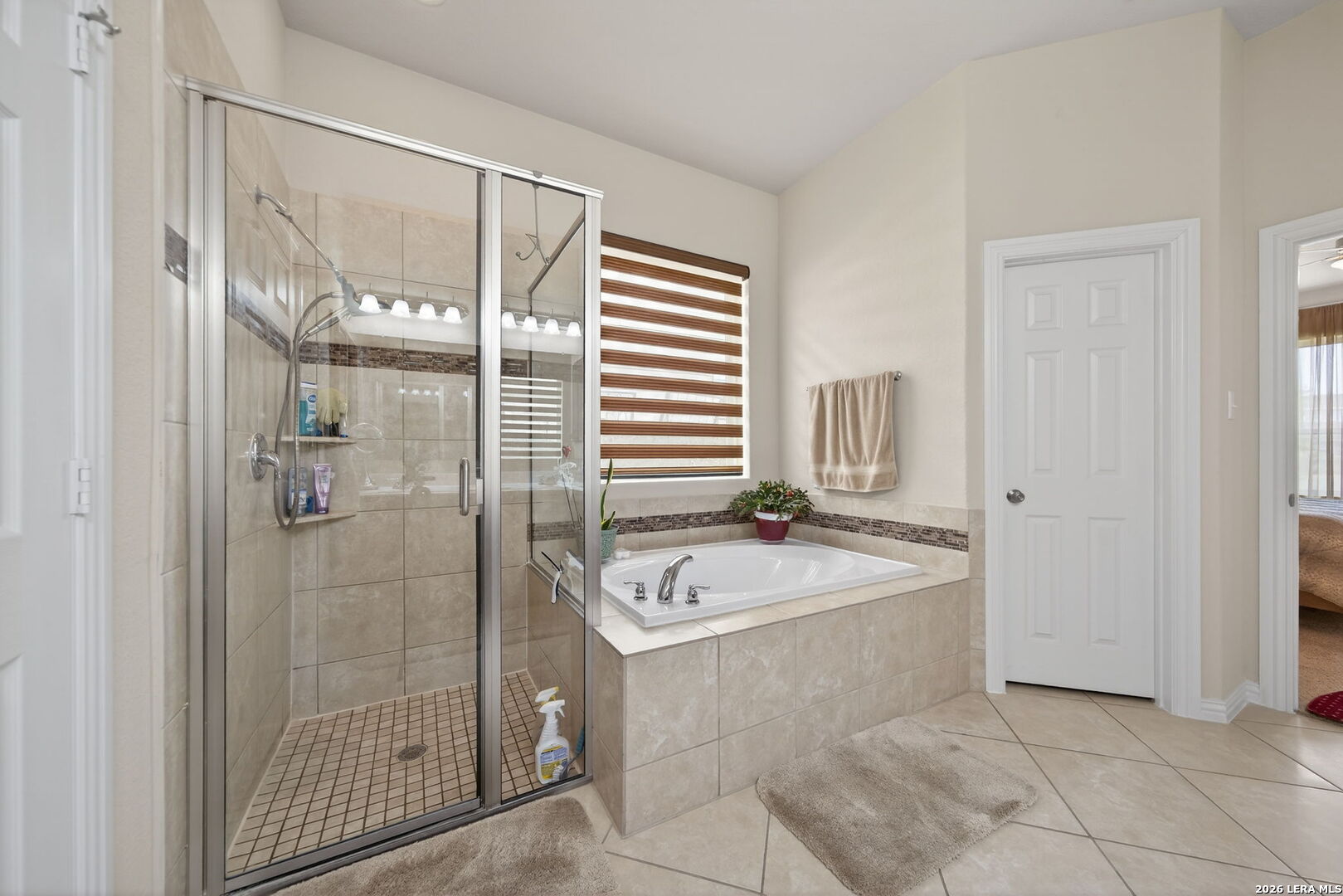 9108 Trail Stem Schertz, TX 78154 - Photo 19 of 26 a spacious bathroom with a shower and a sink