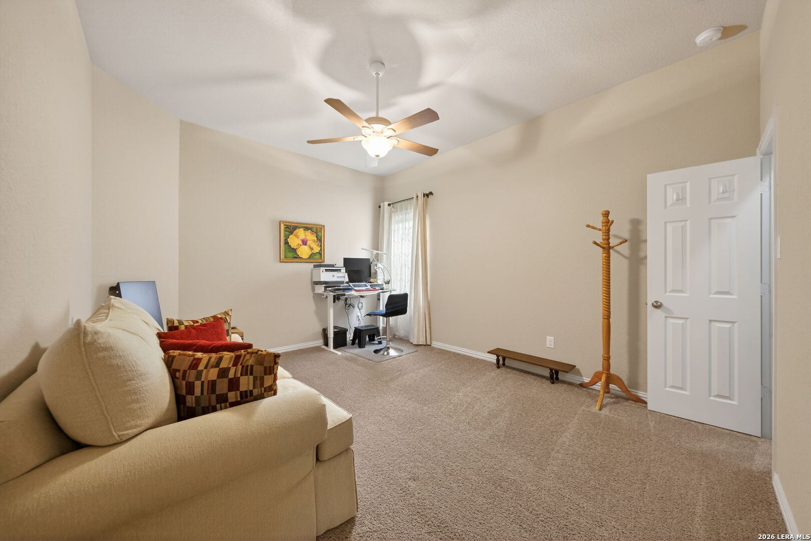 9108 Trail Stem Schertz, TX 78154 - Photo 23 of 26 a living room with furniture gym equipment and a window