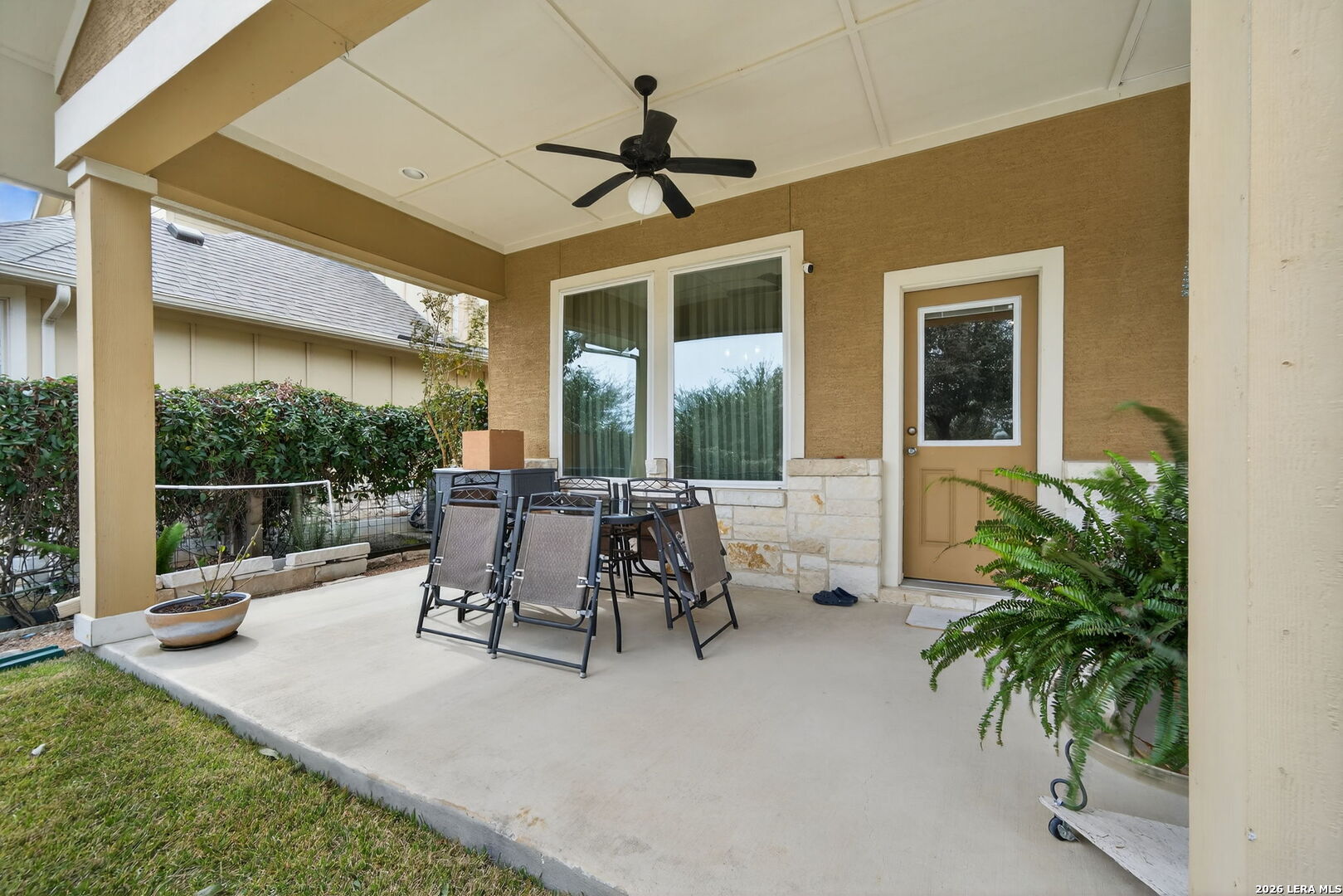 9108 Trail Stem Schertz, TX 78154 - Photo 26 of 26 a view of a patio with a table chairs and garden