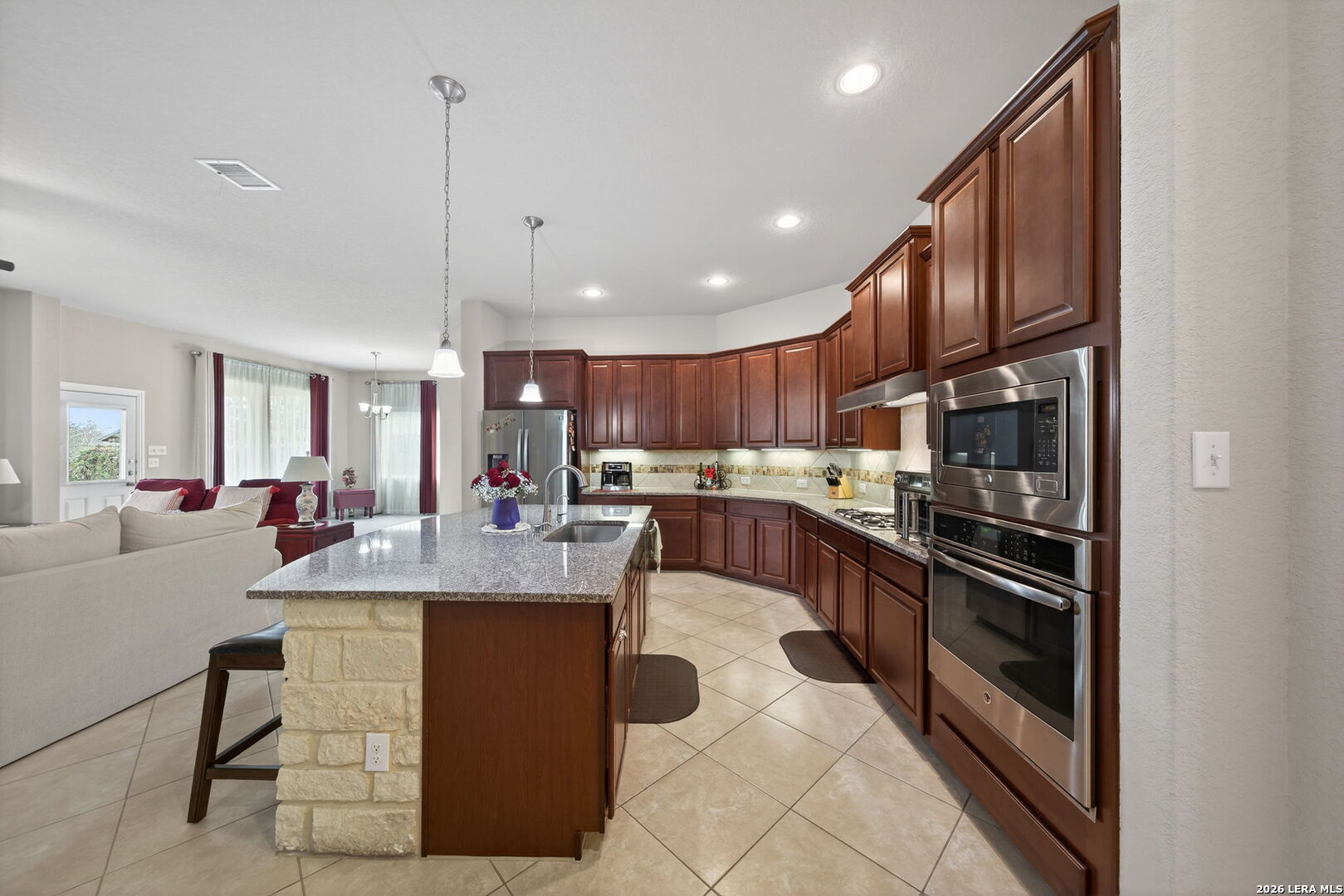 9108 Trail Stem Schertz, TX 78154 - Photo 10 of 26 a large kitchen with lots of counter space a sink and appliances
