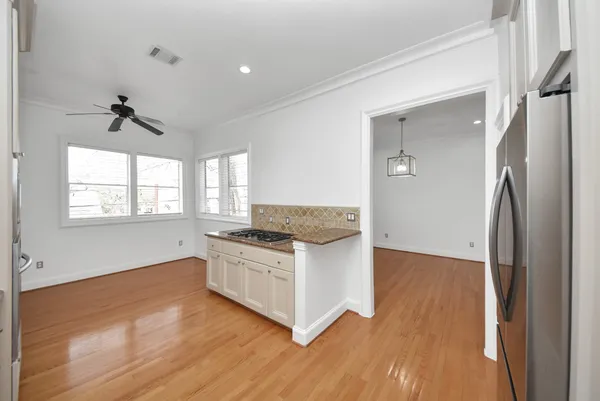 a kitchen with a stove and a refrigerator