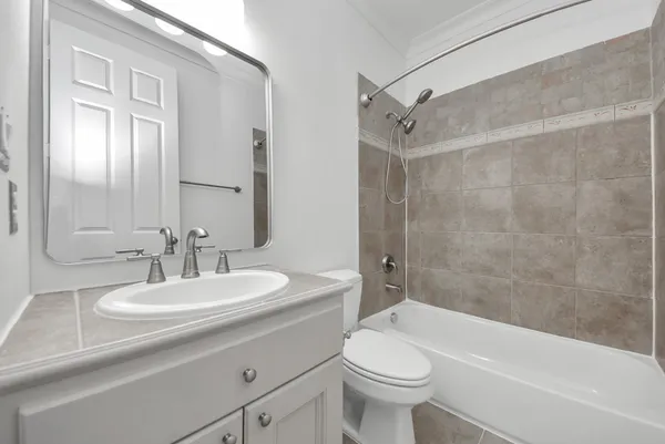 a bathroom with a sink a toilet and a bathtub