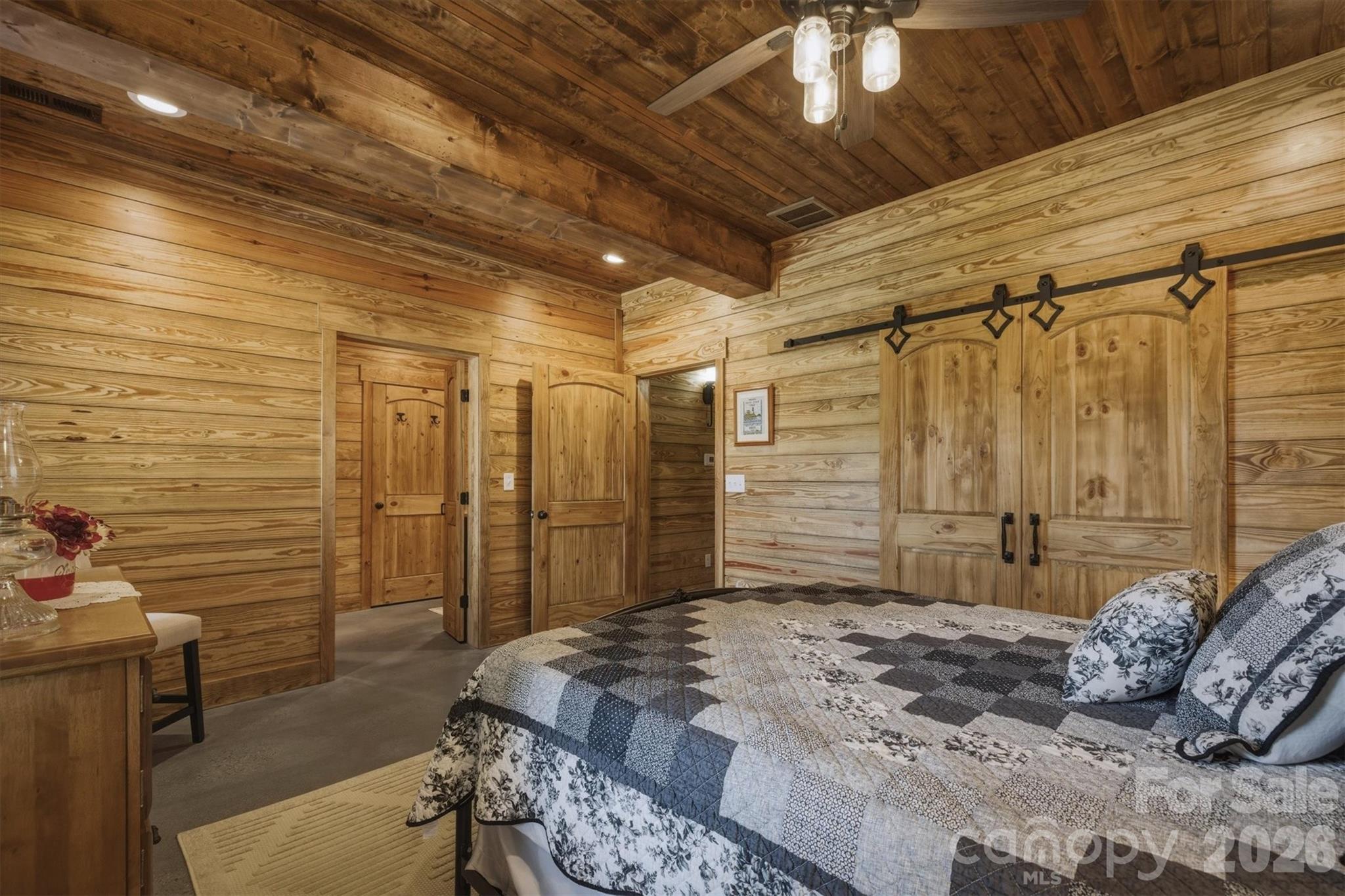 7490 Oak Ridge Church Road Connelly Springs, NC 28612 - Photo 21 of 44 a bedroom with a bed and a walk in closet
