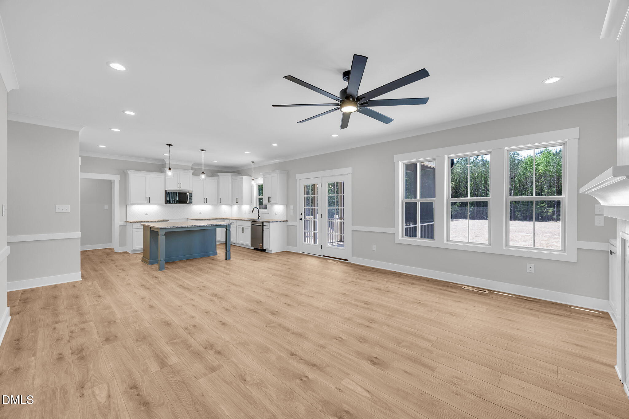 378 Freedom Ridge Drive Smithfield, NC 27577 - Photo 17 of 33 a view of an empty room with wooden floor and a window