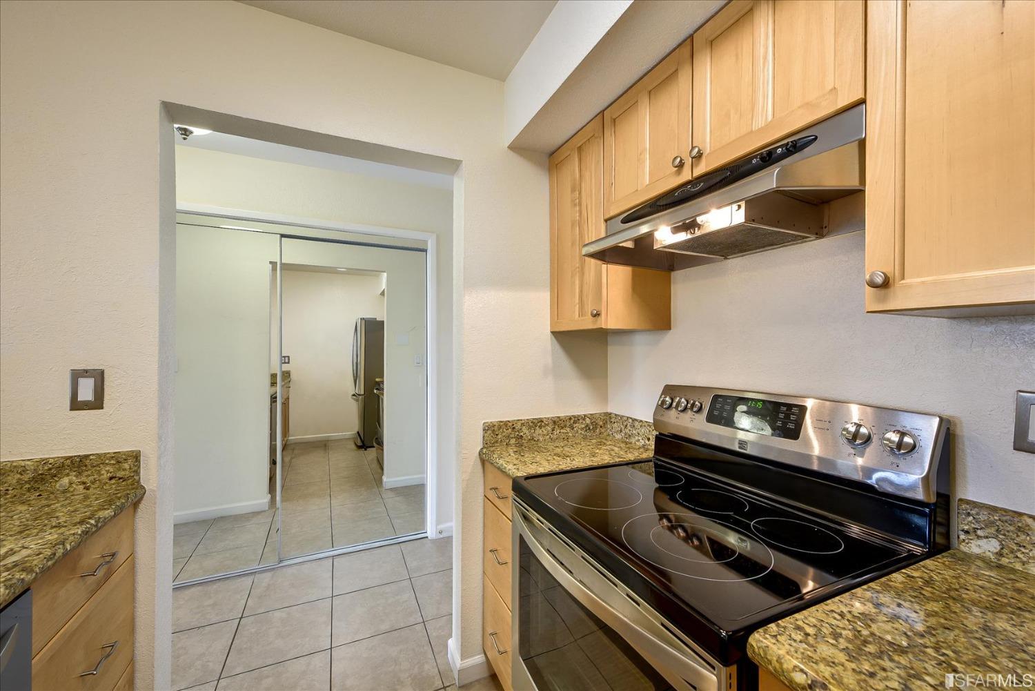 466 Crescent Street, Unit 310 Oakland, CA 94610 - Photo 13 of 24 a kitchen with a stove and a microwave