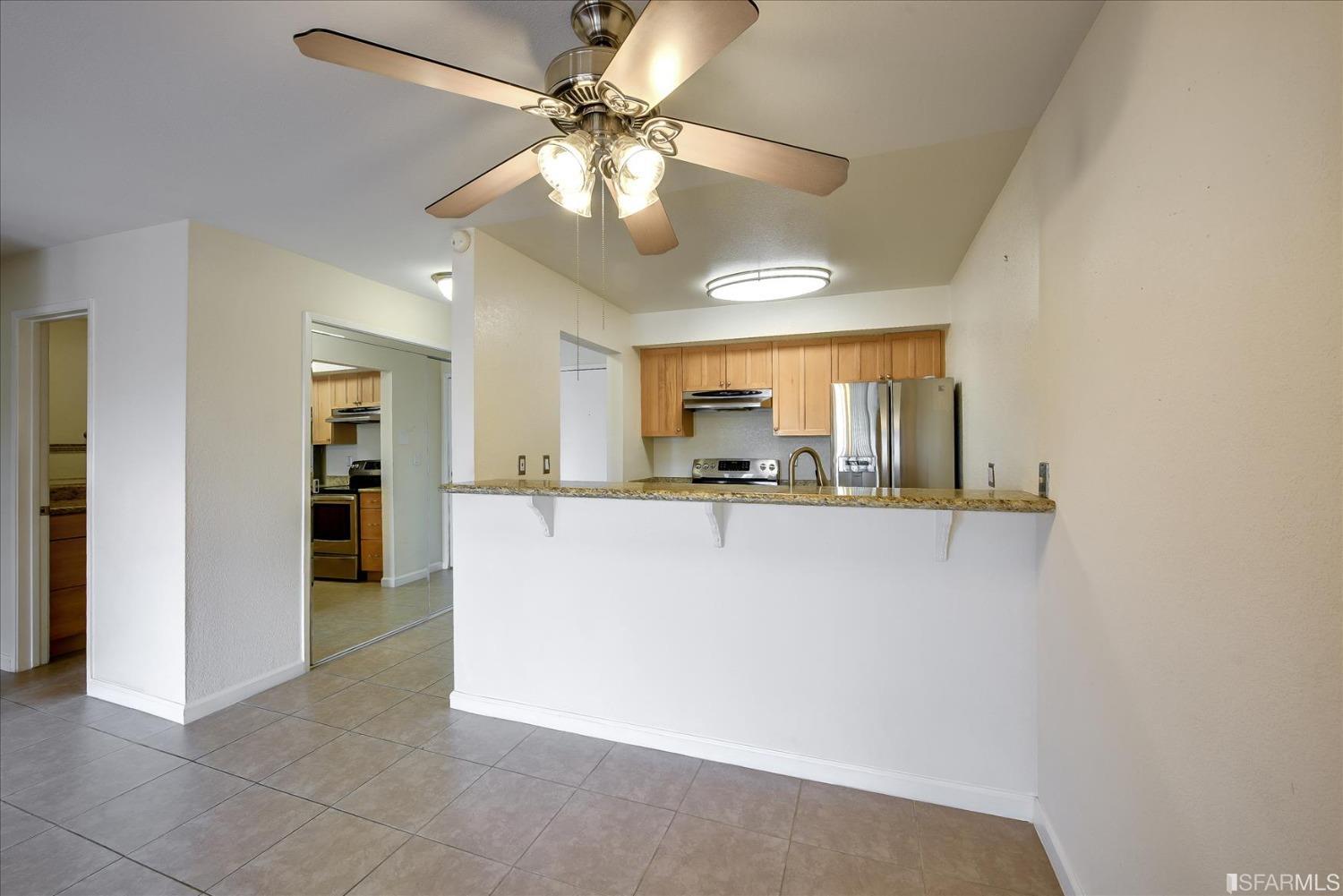 466 Crescent Street, Unit 310 Oakland, CA 94610 - Photo 15 of 24 a view of a kitchen with a sink and a refrigerator