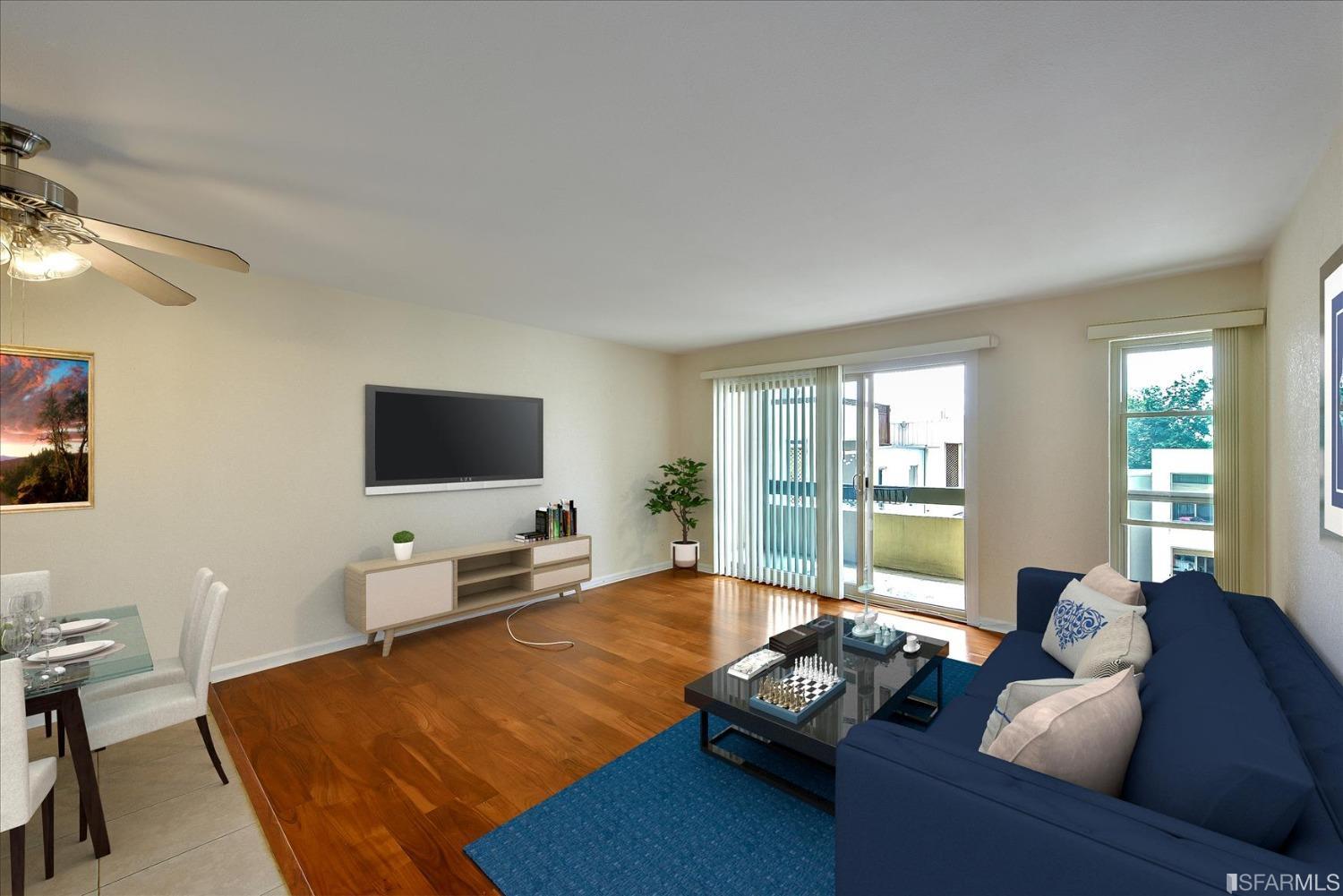 466 Crescent Street, Unit 310 Oakland, CA 94610 - Photo 2 of 24 a living room with furniture window and a flat screen tv