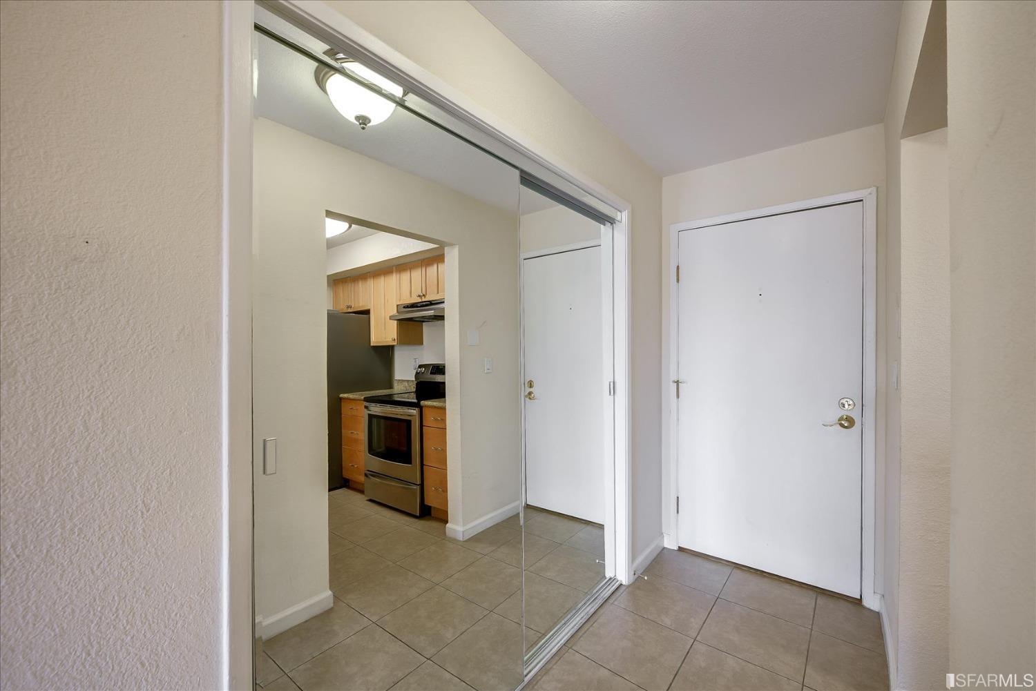 466 Crescent Street, Unit 310 Oakland, CA 94610 - Photo 3 of 24 a view of a hallway and an dining rom with furniture