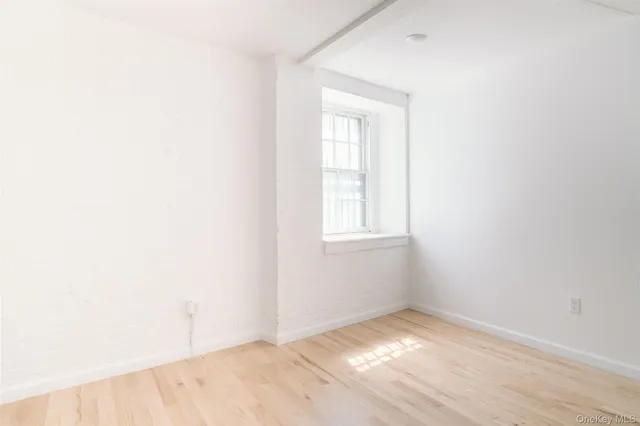 a view of an empty room and window