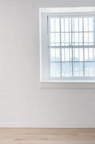 a close up of a wall with a window