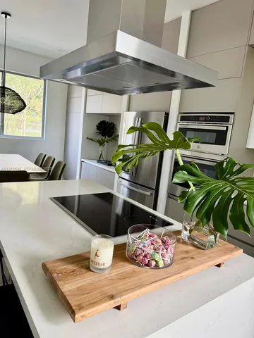 a room with lots of potted plants