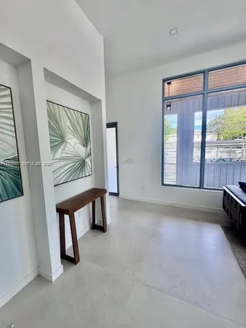 an empty room with wooden floor