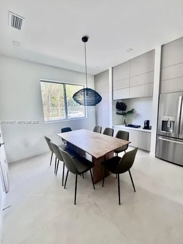 a table and chairs in a kitchen