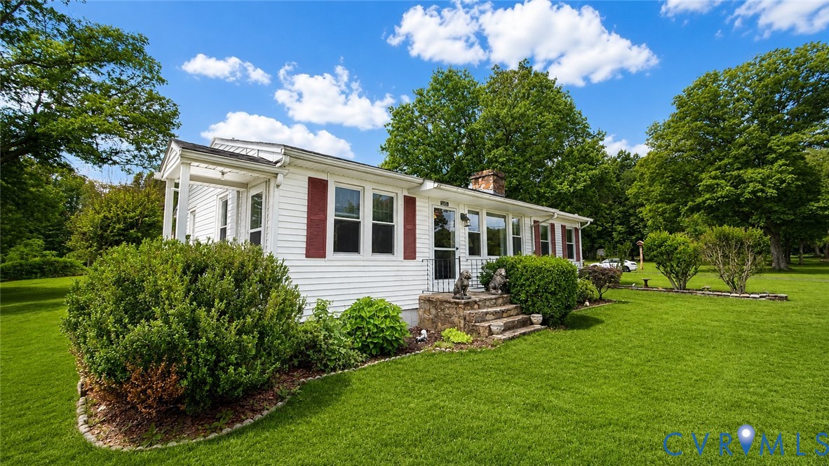 5560 West Hoover Road Reva, VA 22735 - Photo 3 of 32 White siding exterior with red window shutters and
