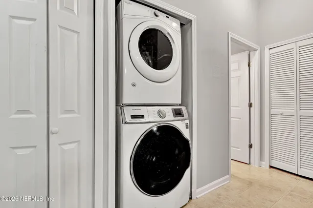 a close view of a utility room with dryer and washer