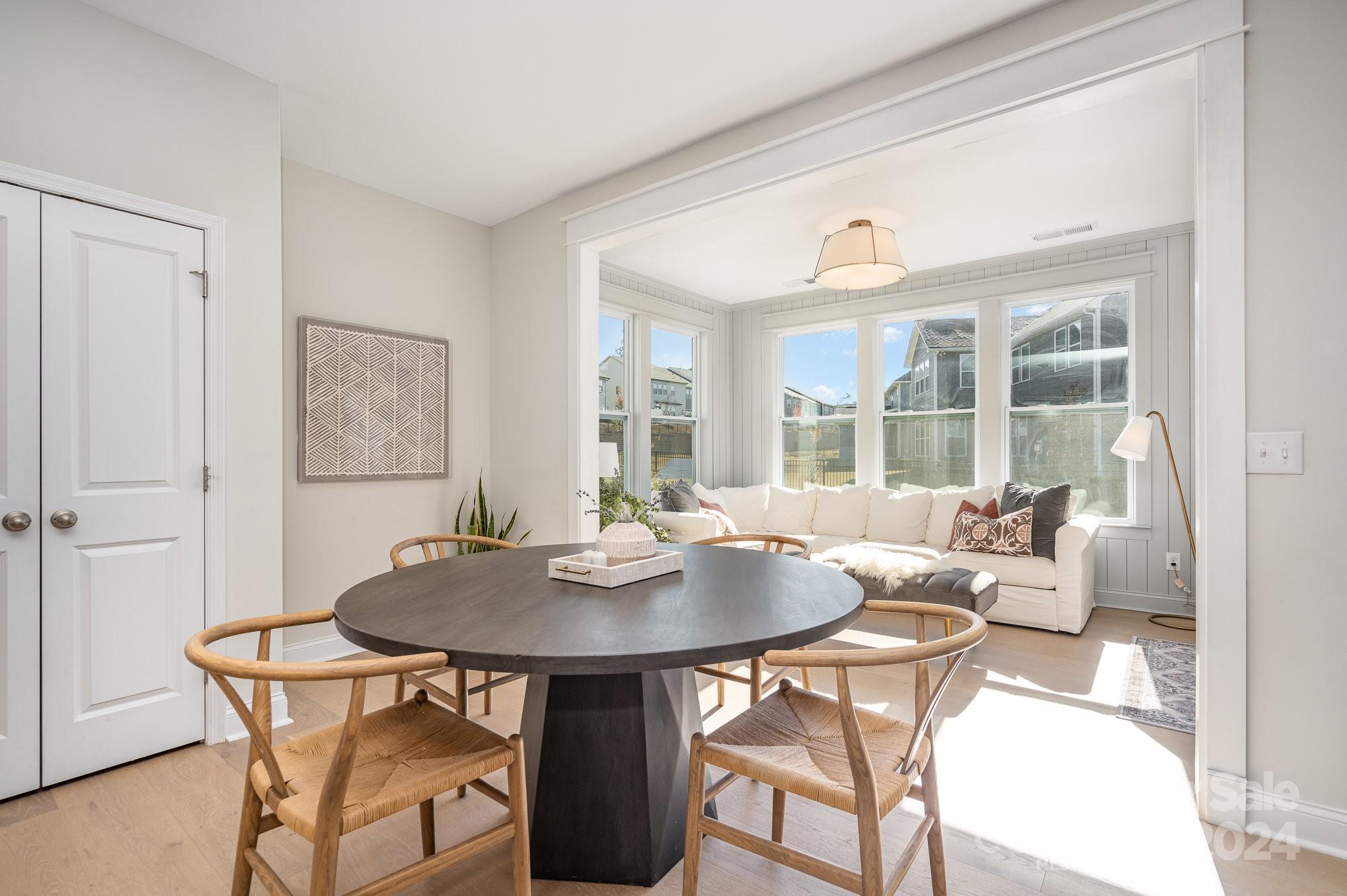 3063 Patchwork Court Fort Mill, SC 29708 - Photo 11 of 28 a dining room with furniture a chandelier and wooden floor