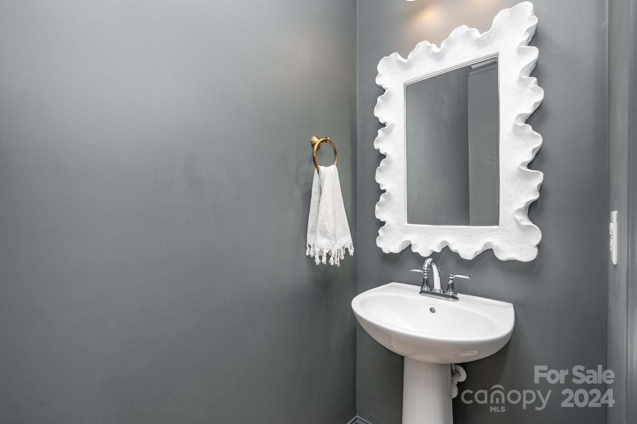 3063 Patchwork Court Fort Mill, SC 29708 - Photo 13 of 28 a bathroom with a sink a mirror and vanity