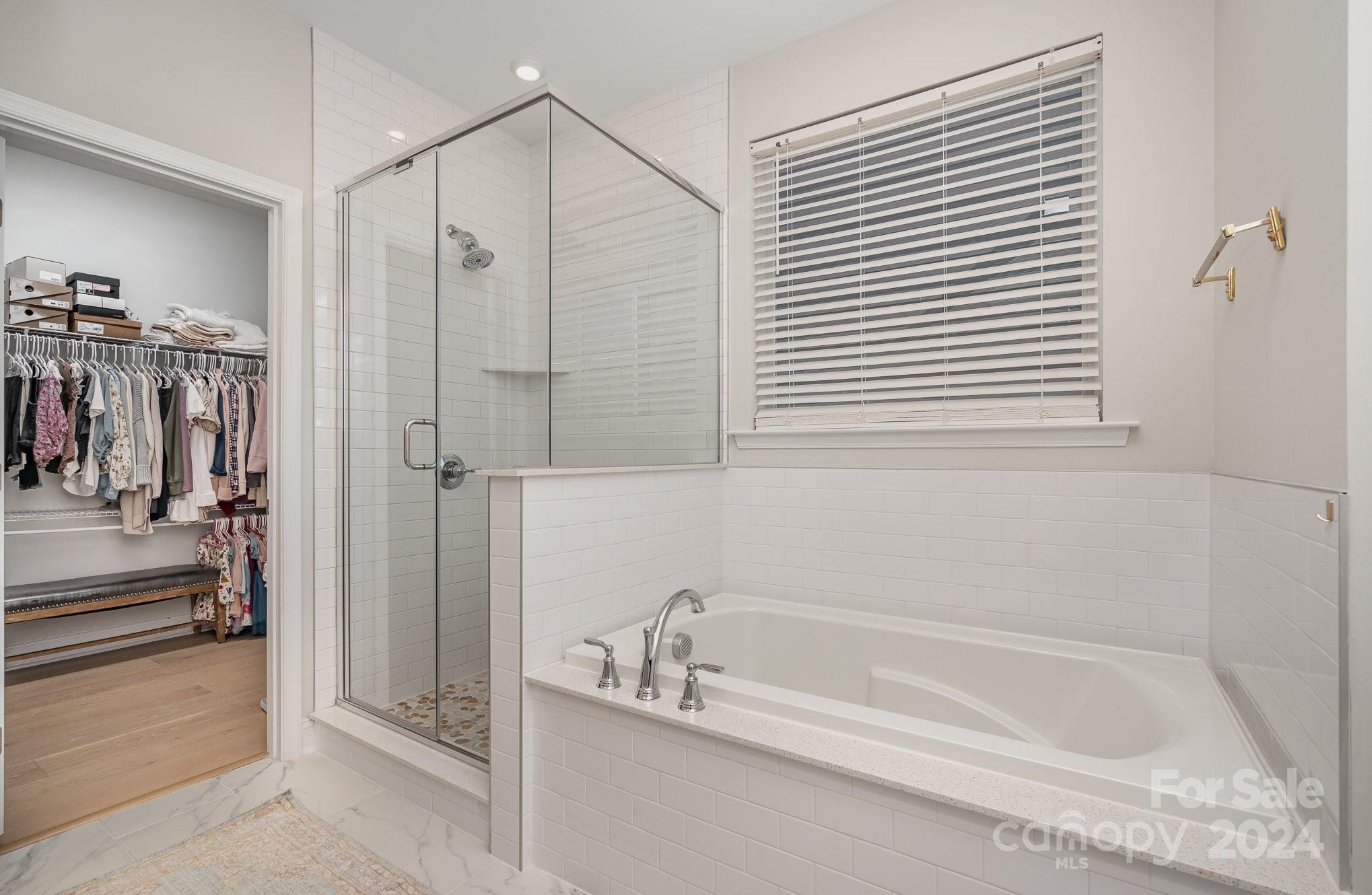 3063 Patchwork Court Fort Mill, SC 29708 - Photo 18 of 28 a bathroom with a bathtub and a shower