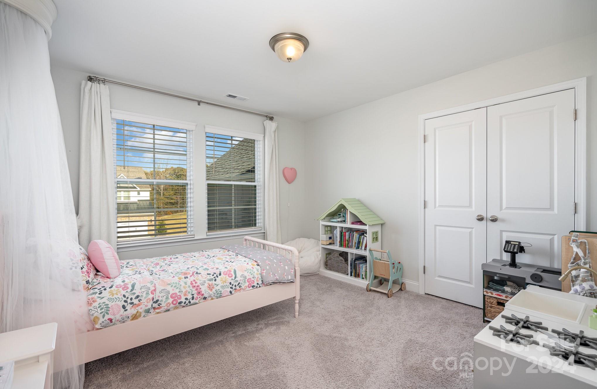 3063 Patchwork Court Fort Mill, SC 29708 - Photo 19 of 28 a bedroom with bed and a window