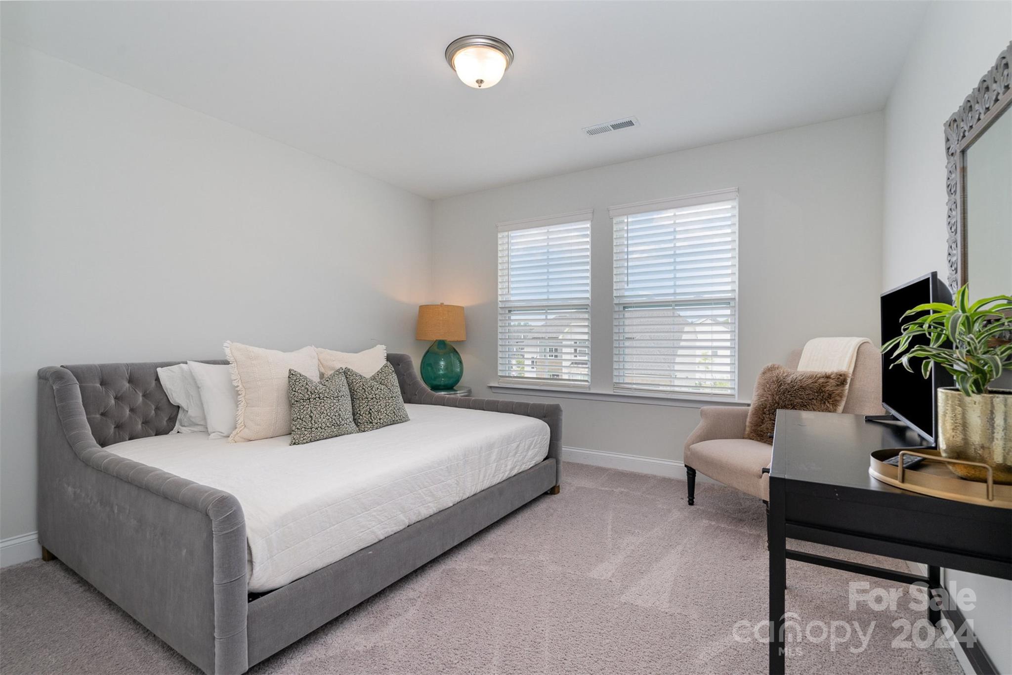3063 Patchwork Court Fort Mill, SC 29708 - Photo 20 of 28 a bedroom with a bed and a potted plant