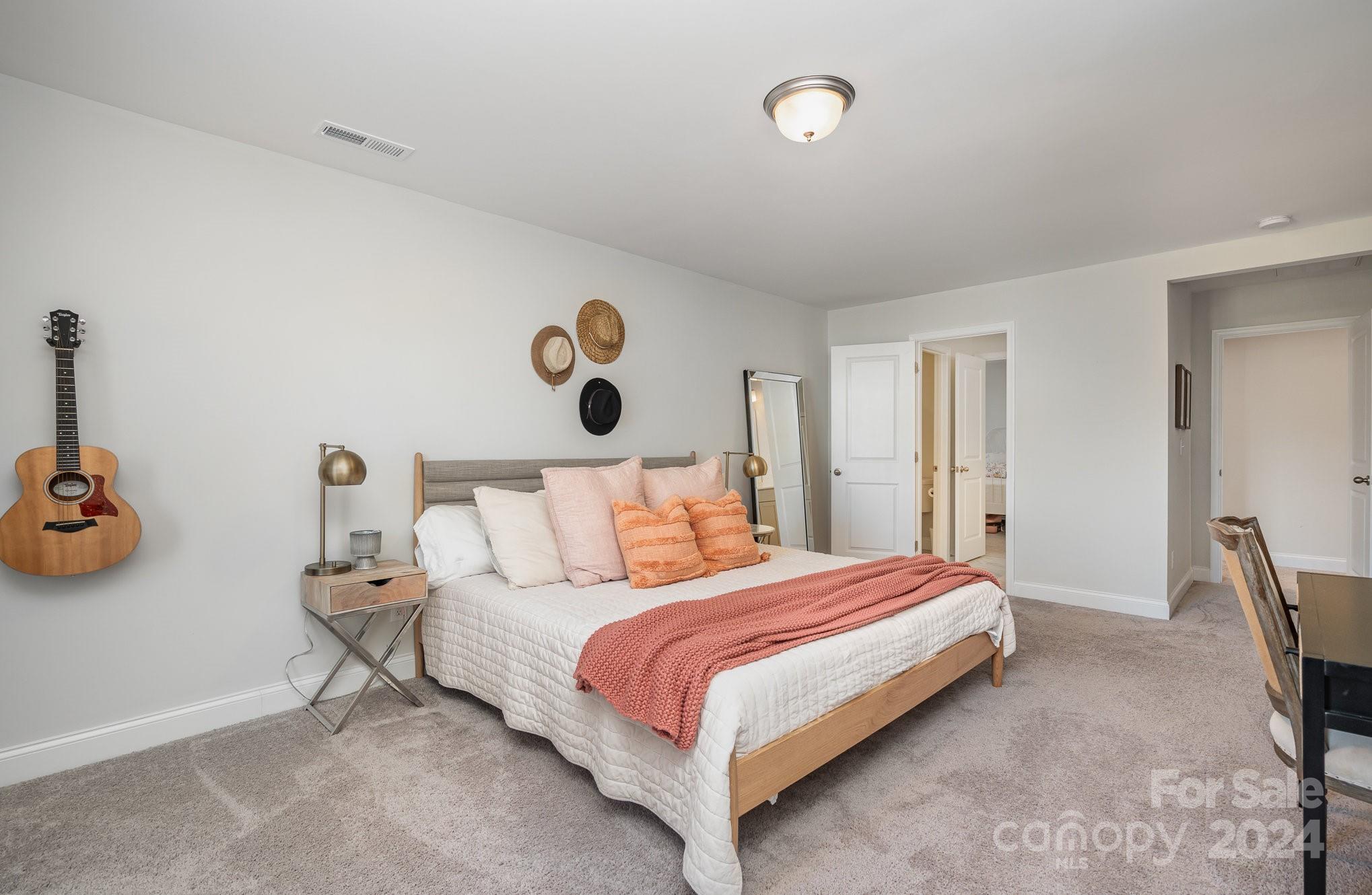 3063 Patchwork Court Fort Mill, SC 29708 - Photo 23 of 28 a bedroom with a bed and painting on the wall